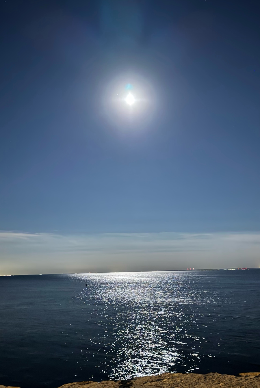 A picture of the moon over Lake Ontario, taken by Stacy W. Nelson.